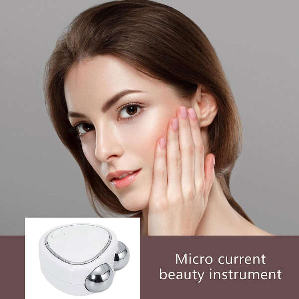 GlowTouch - Mini Facial Massager: Pamper Your Skin!